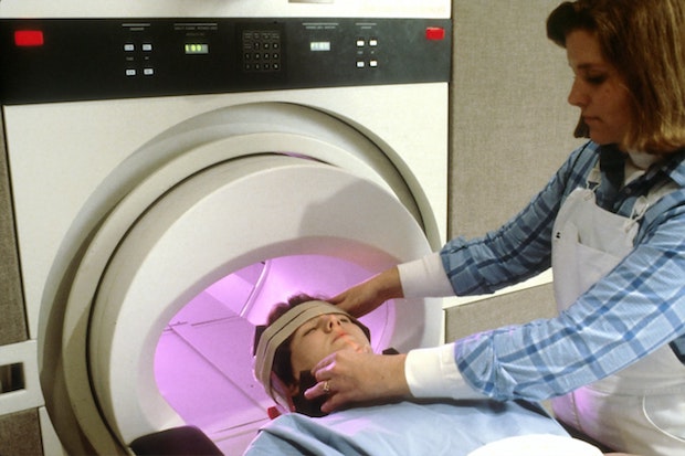 A woman preparing to have an MRI scan