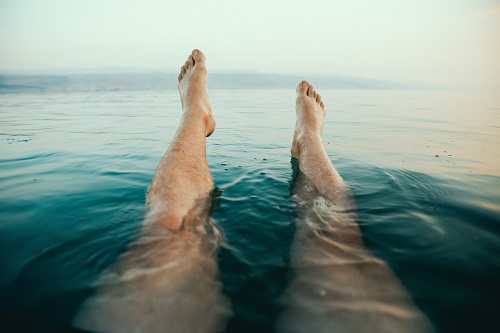 Legs swimming in the ocean